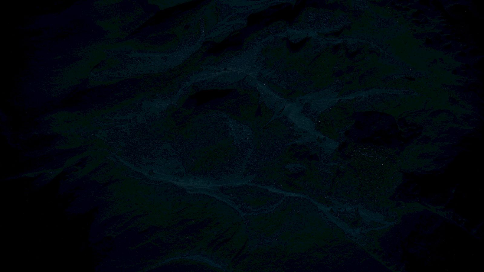 The image is too dark to identify specific objects or details clearly.